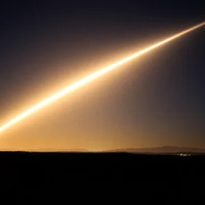 Nighttime view of a bright streak in the sky depicting the SpaceX Dragon reentry