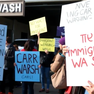 Community gathering with signs supporting immigrant rights