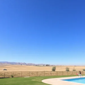 Sunny landscape of Bakersfield with clear blue skies and a poolside scene.
