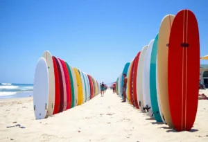 Beach scene in Huntington Beach with surfboards and low waves